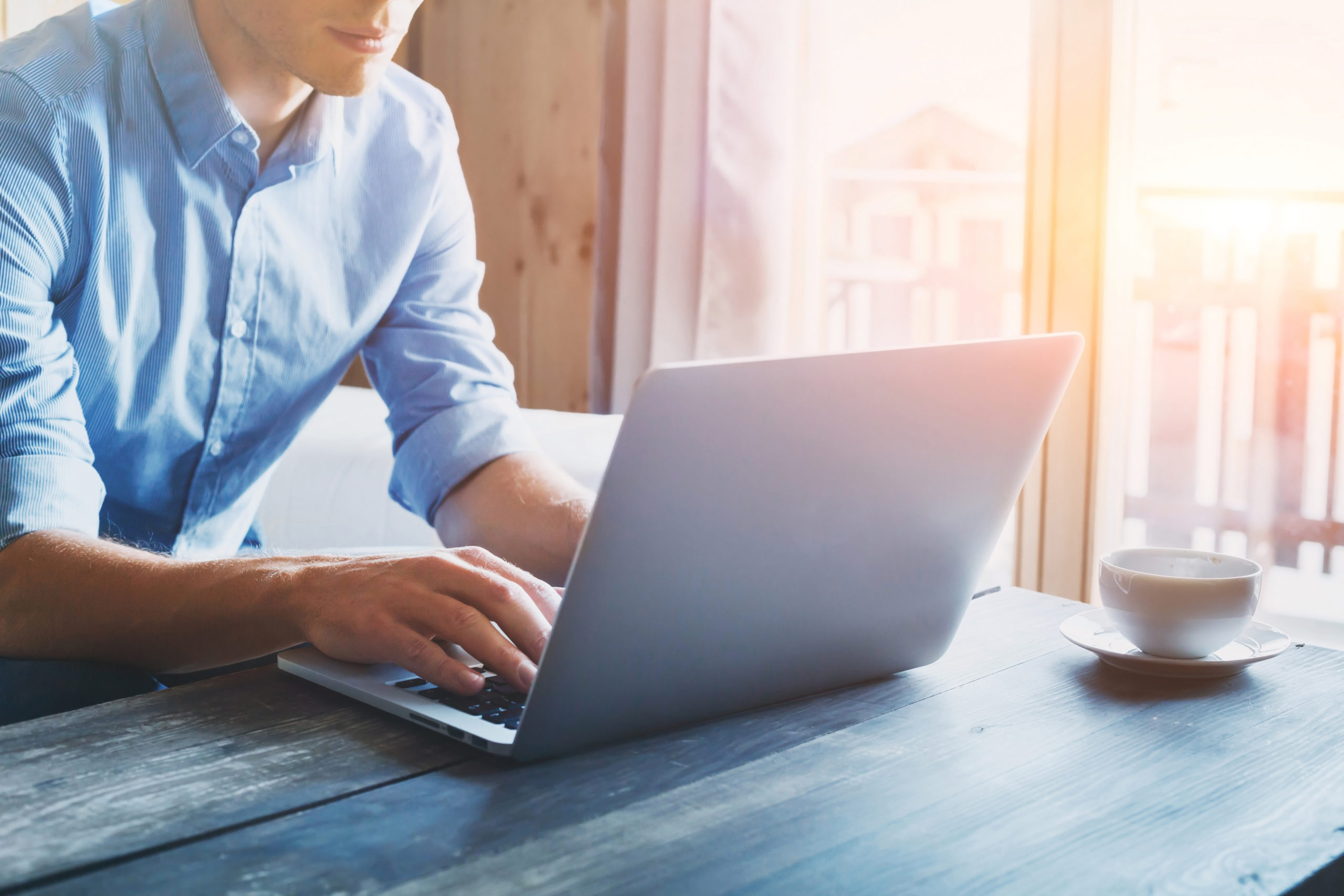 entrepreneur working on laptop online, man using computer